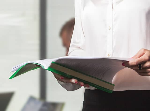 man reviewing a bound report